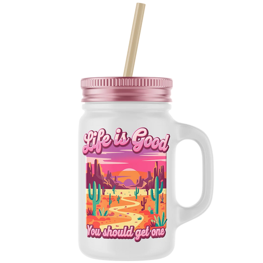 Custom DTF printed mason jar mug with a vibrant desert landscape graphic. This durable and unique print is perfect for creating personalized gifts and merchandise in Miami, Florida.